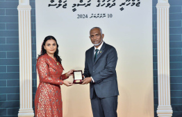 President Dr. Mohamed Muizzu conferring awards to high achievers in their respective fields -- Photo: President's Office