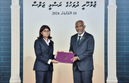 President Dr. Mohamed Muizzu conferring awards to high achievers in their respective fields -- Photo: President's Office