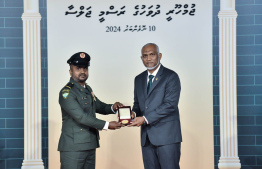 President Dr. Mohamed Muizzu conferring awards to high achievers in their respective fields -- Photo: President's Office