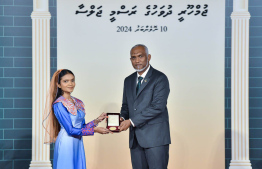 President Dr. Mohamed Muizzu conferring awards to high achievers in their respective fields -- Photo: President's Office