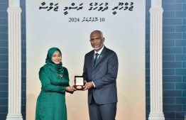 President Dr. Mohamed Muizzu conferring awards to high achievers in their respective fields -- Photo: President's Office