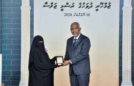 President Dr. Mohamed Muizzu conferring awards to high achievers in their respective fields -- Photo: President's Office