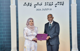 President Dr. Mohamed Muizzu conferring awards to high achievers in their respective fields -- Photo: President's Office