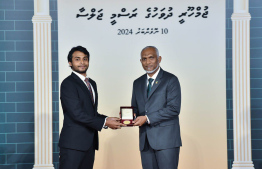 President Dr. Mohamed Muizzu conferring awards to high achievers in their respective fields -- Photo: President's Office