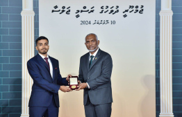 President Dr. Mohamed Muizzu conferring awards to high achievers in their respective fields -- Photo: President's Office