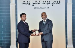 President Dr. Mohamed Muizzu conferring awards to high achievers in their respective fields -- Photo: President's Office