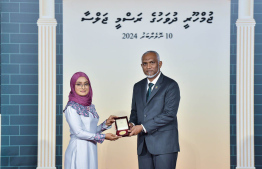 President Dr. Mohamed Muizzu conferring awards to high achievers in their respective fields -- Photo: President's Office