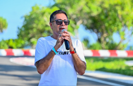 A staff member of Kandima Maldives providing information about the e-go-karting track, during the inauguration event -- Photo: Fayaz Moosa | Mihaaru