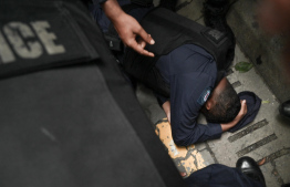 A police officer injured during the protest -- Photo: Nishan Ali