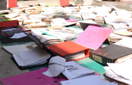 City Council employees work to dry the documents affected in the fire on Thursday -- Photo: Male' City Council