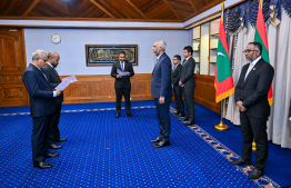 The two new members take their oath of office -- Photo: President's Office