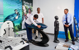 Minister Saeed trying out Sea Gear's new product at the Maldives Marine Expo 2025, one of the largest marine events in the country -- Photo: Fayaz Moosa | Mihaaru