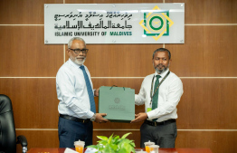 During the signing ceremony between IUM and parliament -- Photo: Parliament