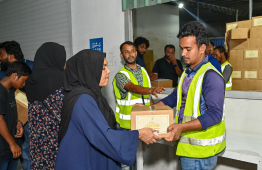 Fish can cases being distributed in the Malé area ahead of Ramadan -- Photo: Nishan Ali -- Mihaaru