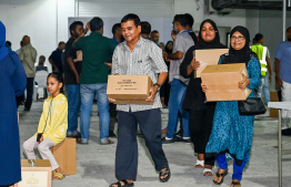 Fish can cases being distributed in the Malé area ahead of Ramadan -- Photo: Nishan Ali | Mihaaru