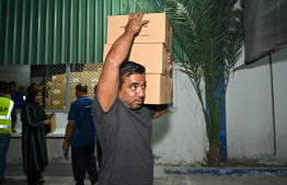Fish can cases being distributed in the Malé area ahead of Ramadan -- Photo: Nishan Ali | Mihaaru
