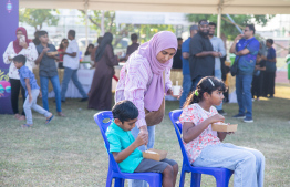 Children eating at the Bingaa maahefun event by MIB held last Friday -- Photo: MIB