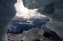 Icicles hang from a beached iceberg in Nuuk, Greenland, on March 4, 2025. US President Donald Trump has strained relations with Denmark by repeatedly signalling that he wants control over Greenland, an autonomous Danish territory which will hold legislative elections on March 11. (Photo by Odd ANDERSEN / AFP)