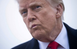 US President Donald Trump speaks to the press about the conflict in Ukraine before boarding Air Force One at Andrews Air Force Base March 14, 2025, in Maryland. Trump is spending the weekend at his Florida Mar-a-Lago resort. (Photo by Brendan Smialowski / AFP)